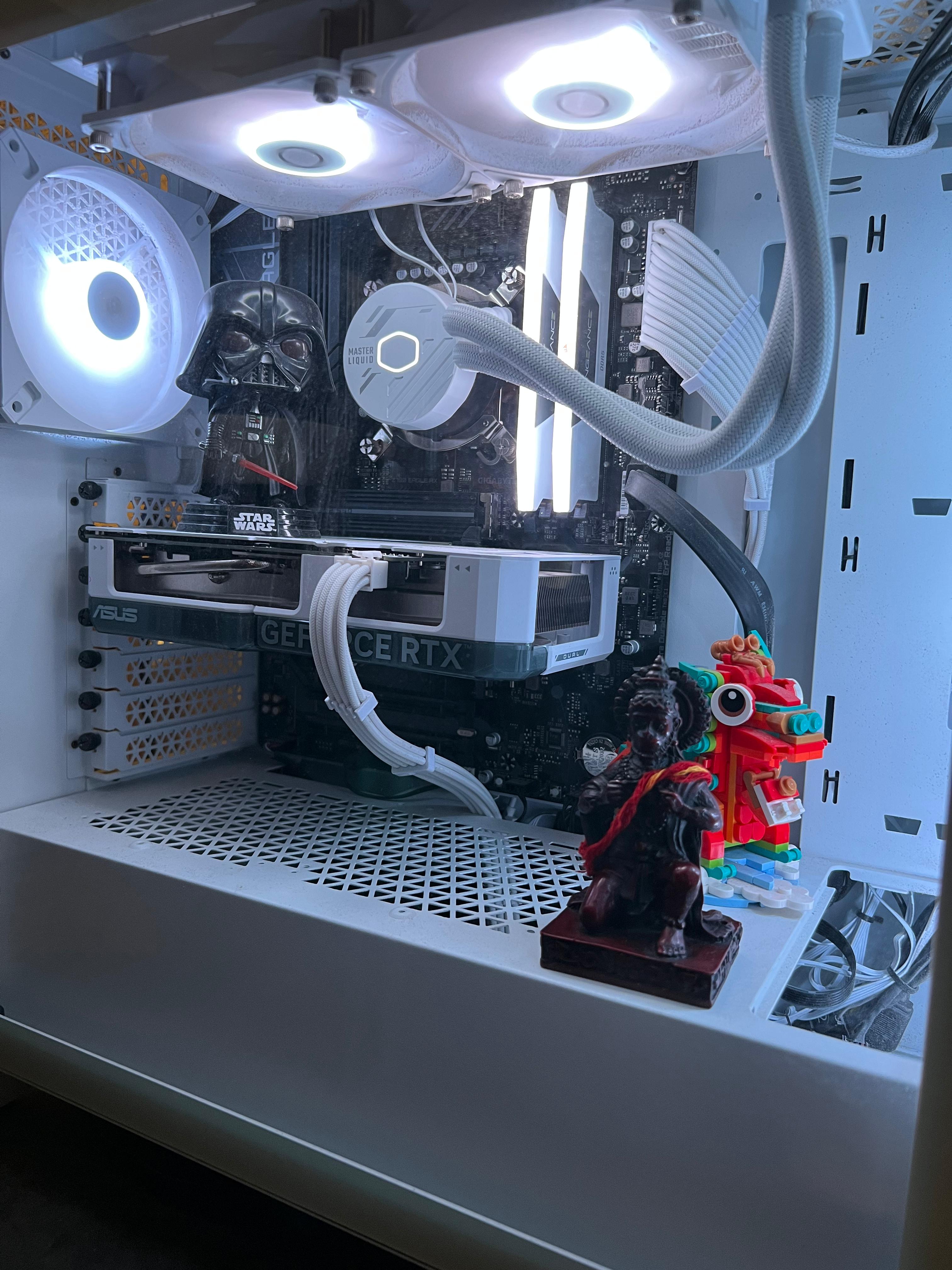 Custom white PC build — ASUS RTX GPU and AIO liquid cooling inside